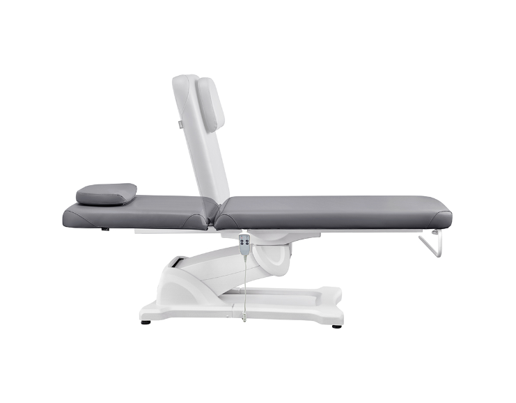 Serenity Electric Treatment Table DIR by DIR with headrest, flat armrests, and remote control.