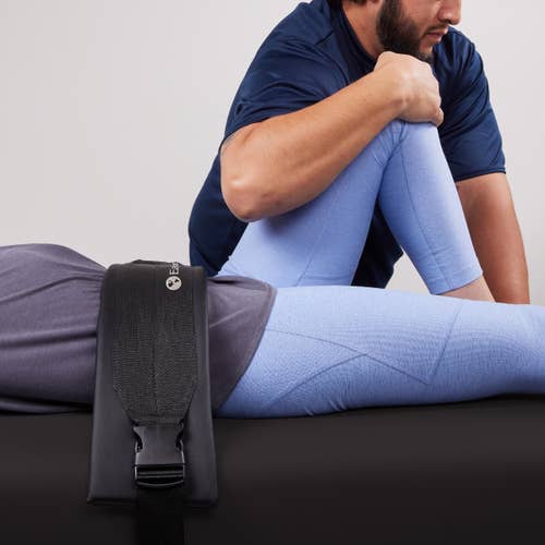 Person receiving assisted stretch on EarthLite ELLORA Table with Stretch Assist System.
