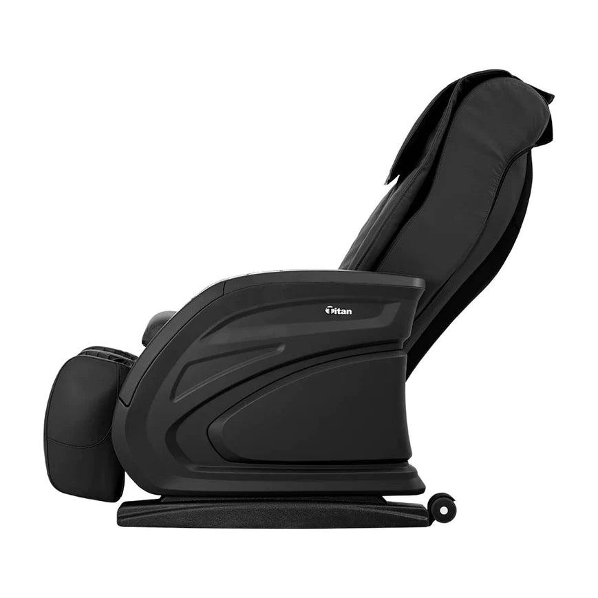 Titan Vending Massage Chair by Titan, reclining with footrest, side view on white background.