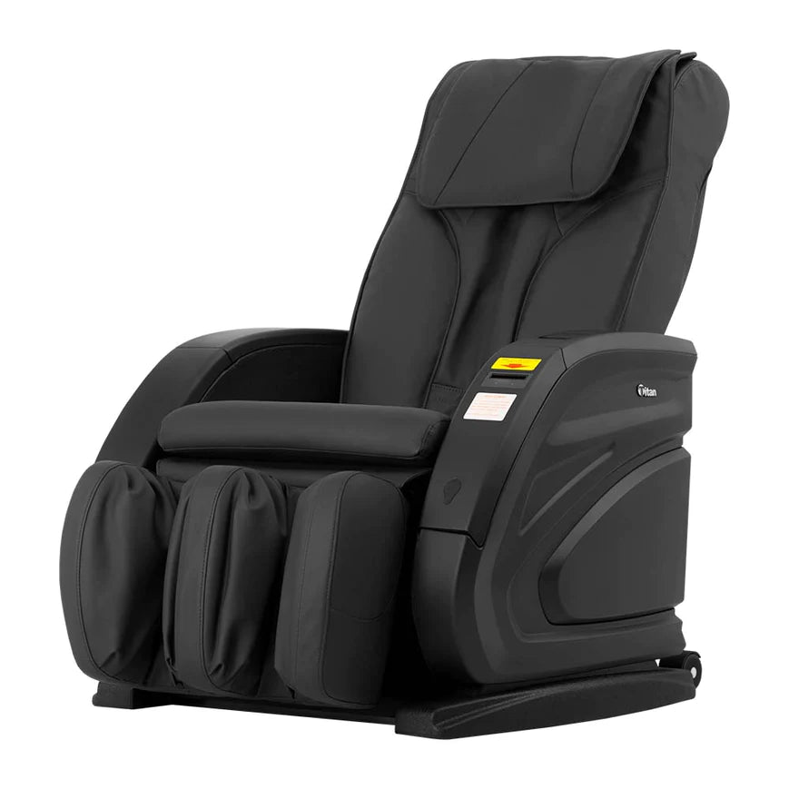 Titan Vending Massage Chair by Titan: Black leather, padded armrests, and leg supports.