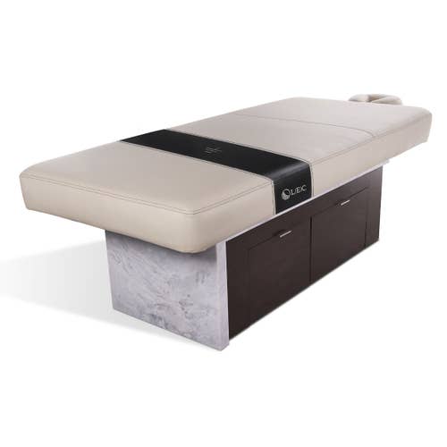 INSIGNIA 2.0 Waterfall spa table by Living Earth Crafts with cushioned top and storage drawers.