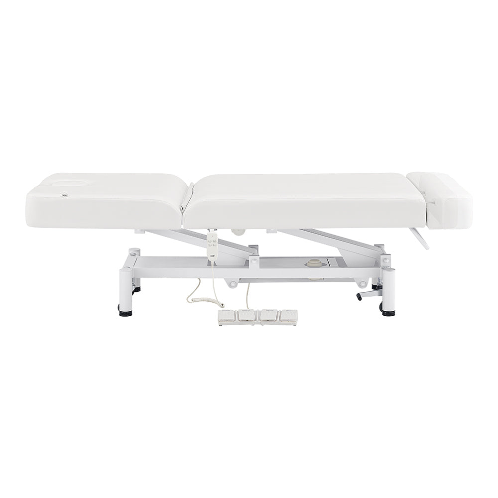 DIR WellRelax Treatment Table with metal frame and foot controls for versatile treatments.