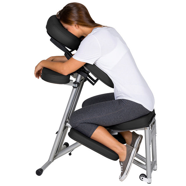 Woman on Stronglite ERGO PRO II Massage Chair with head on face cradle.