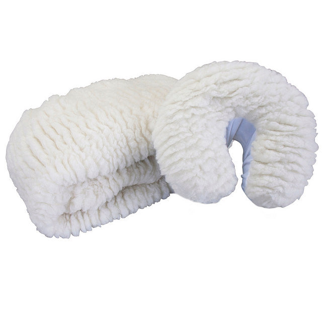 A white fleece massage table pad with fitted corners and a snug fit elastic band, designed to wrap around the sides of a massage table.
