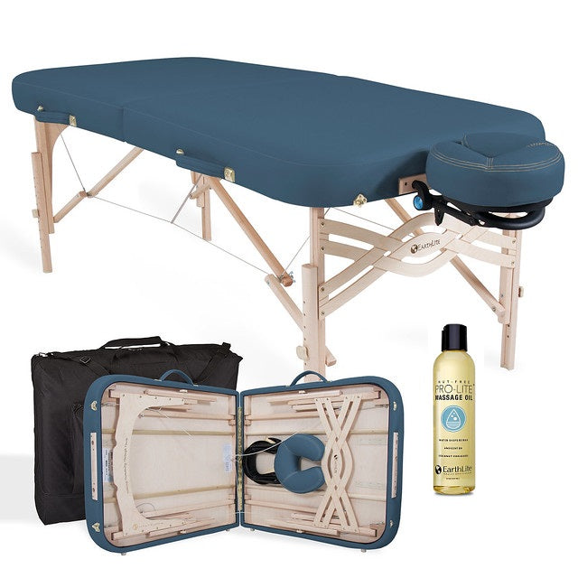 EarthLite SPIRIT Portable Massage Table set with carry case, face cradle, and oil.