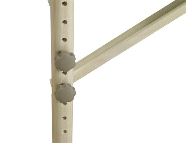Close-up of Nirvana 2n1 Portable Massage Table frame with adjustable knobs and support bar.