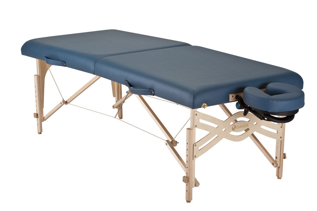 EarthLite SPIRIT portable massage table with wood legs and face cradle, ideal for therapists.