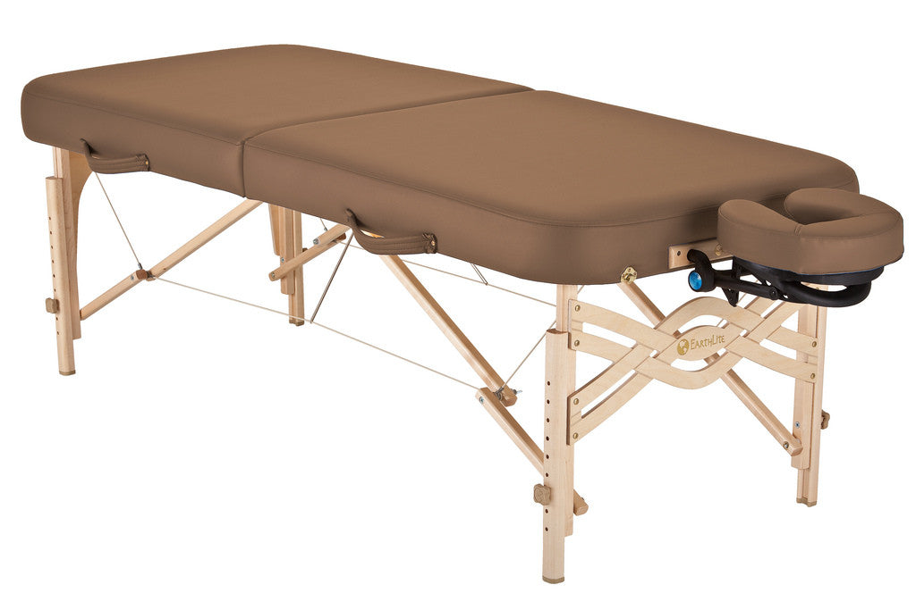 EarthLite SPIRIT portable massage table in brown with wood legs and face cradle.