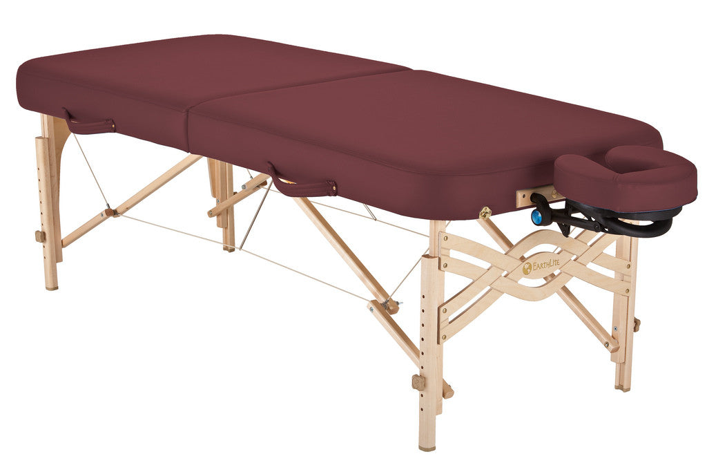 Burgundy EarthLite SPIRIT portable massage table with wooden legs and adjustable face cradle.