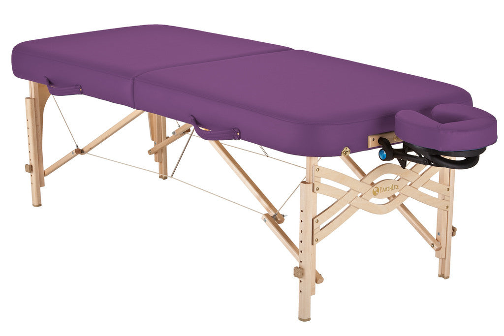 EarthLite SPIRIT portable massage table with wooden legs and detachable face cradle.