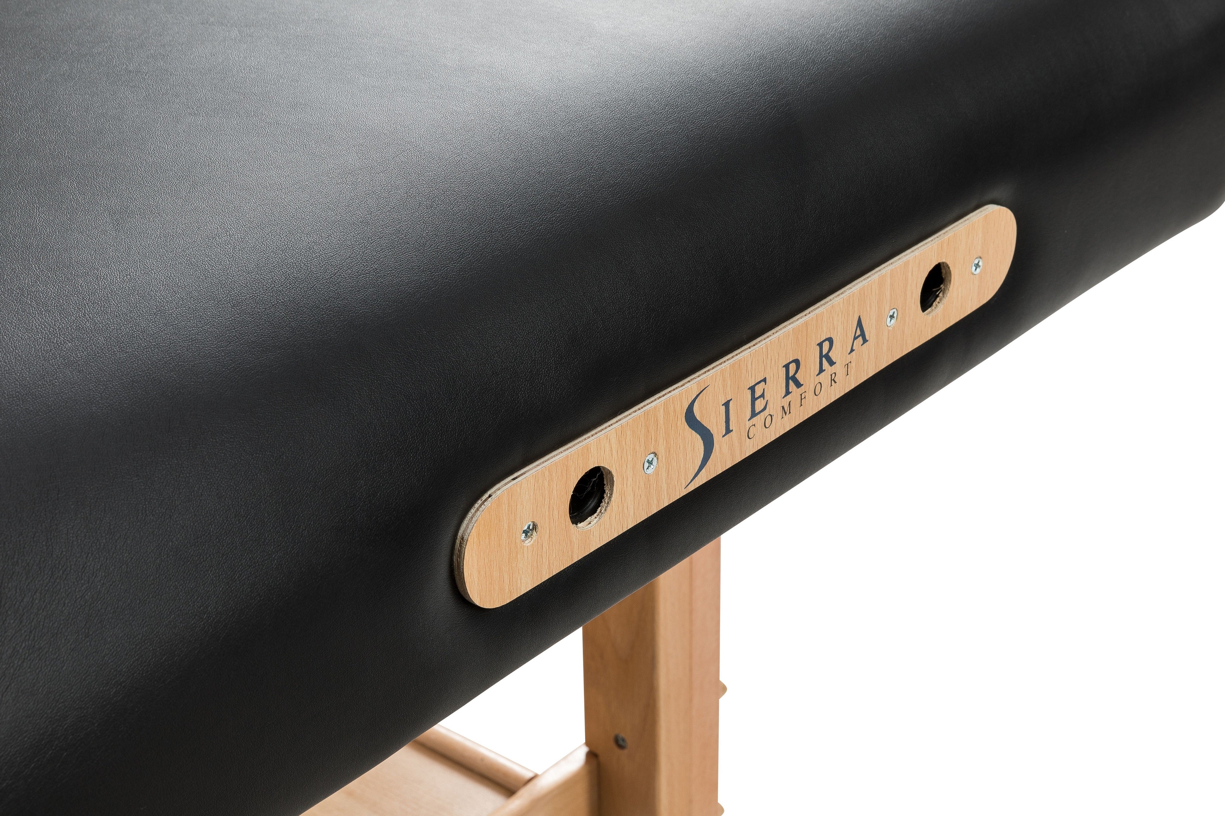 Sierra Comfort Adjustable 4-Section Massage Table with beech legs and logo on the side.