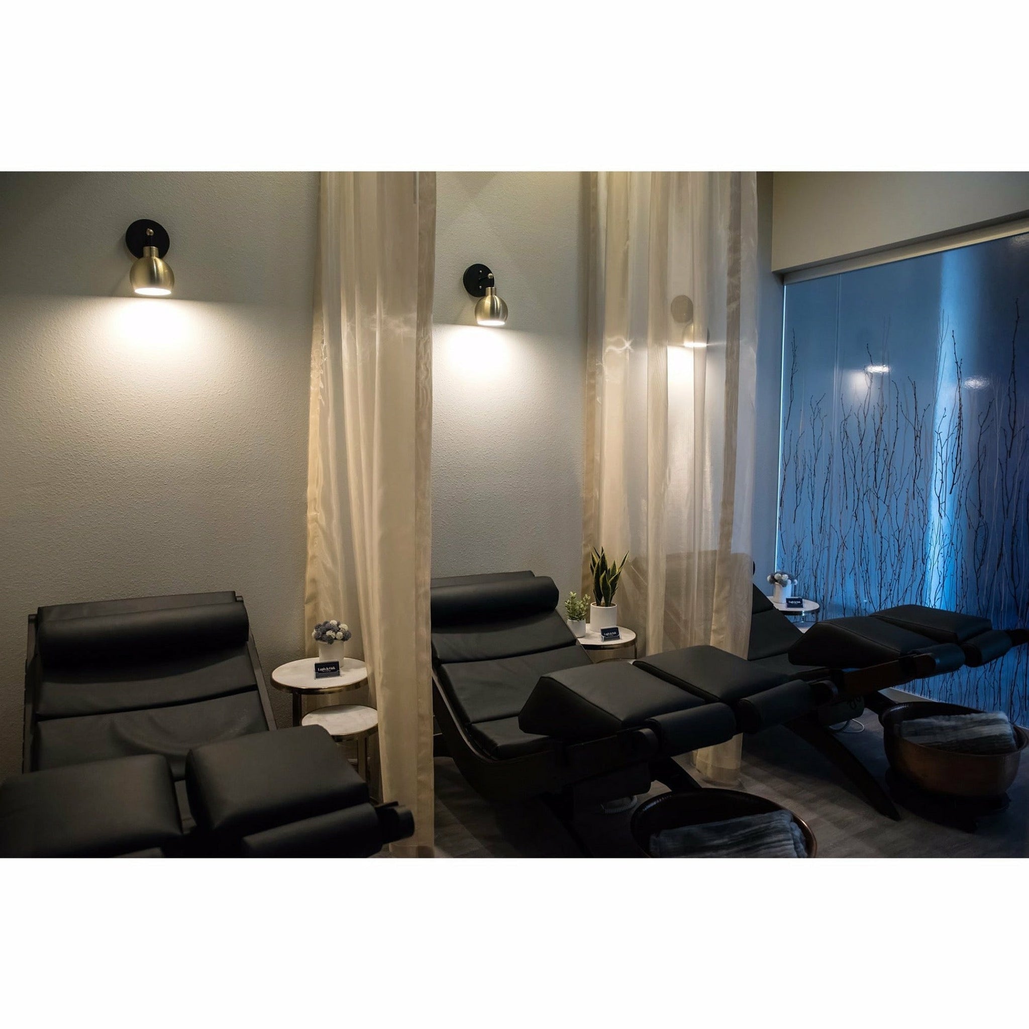 Three TouchAmerica Breath Pedi-Lounges with RX Sound and Split Knee Cushion in a dim lounge.