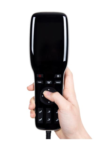 A hand holds an Osaki remote for the Ador 3D Allure Electric Massage Chair with multiple buttons.