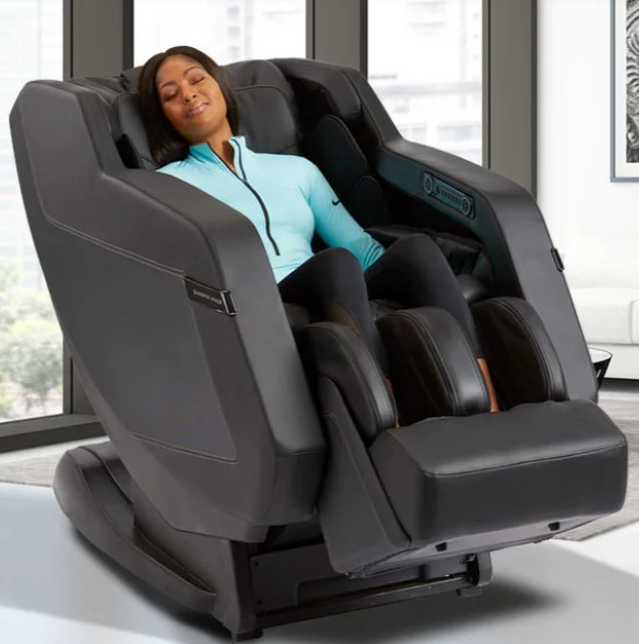 Woman relaxing in a Sharper Image RELIEVE 3D Massage Chair enjoying deep tissue massage.