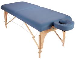 Custom Craftworks ATHENA portable massage table with wooden legs and face cradle for comfort.