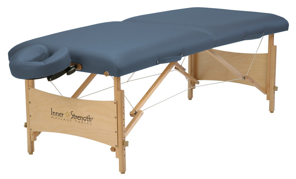 The Inner Strength ELEMENT Portable Massage Table Package features a blue cushion and hardwood frame.