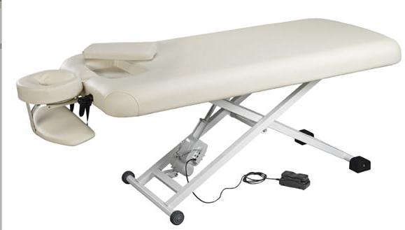Nirvana Electric Massage Table with face cradle and foot pedal on white background.