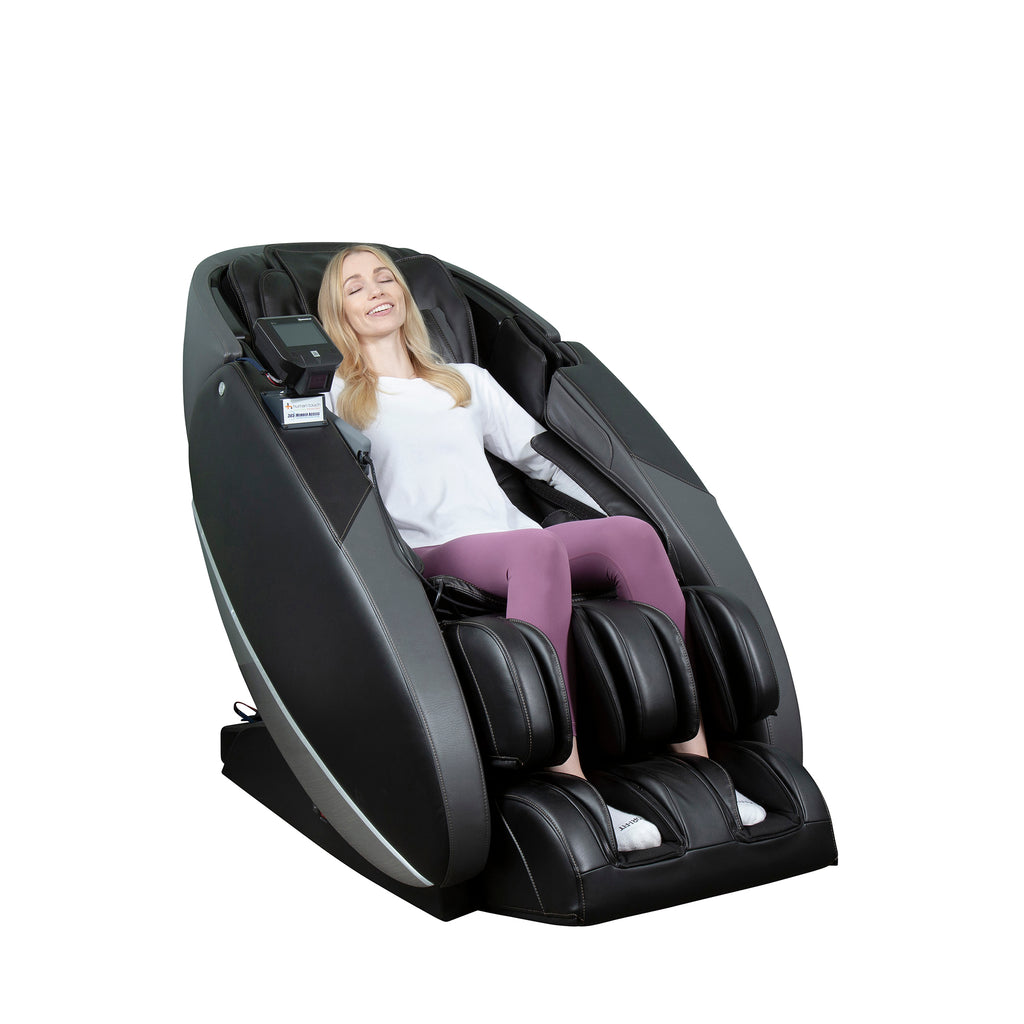 Woman relaxes in Human Touch NOVO XT Pro Massage Chair, black antimicrobial upholstery, eyes closed.