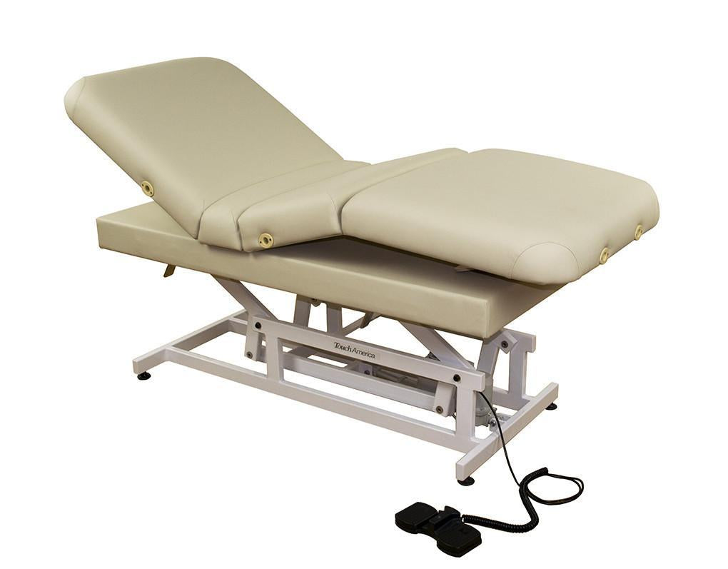 TouchAmerica HILO MULTIPRO beige ADA exam table with foot pedal on white background.