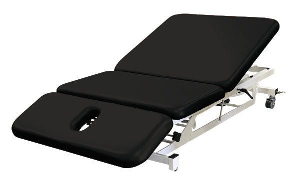PHS Medical Thera-P Bobath Electric Treatment Table with face cutout, metal frame, and wheels.