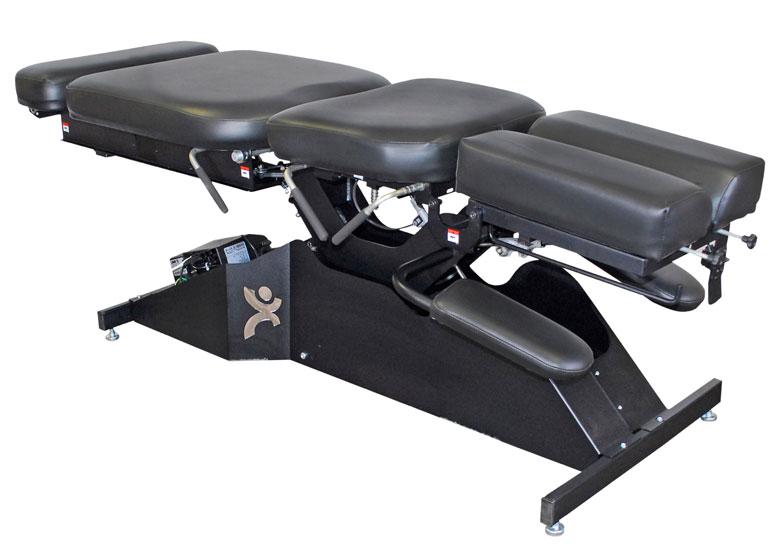 PHS Chiropractic TradeMark Adjusting Table with adjustable headpiece and padded sections.