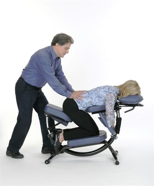 A person gets a massage on a Pisces Pro DOLPHIN II Portable Massage Chair.