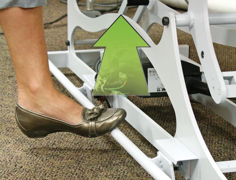 A person uses the HANDS FREE BASIC Therapy Lift Table by Custom Craftworks; green arrow points up.