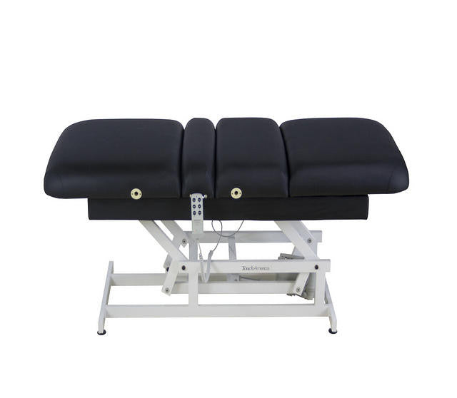 TouchAmerica HILO POWERTILT: Black motorized ADA-compliant massage table with white metal base.
