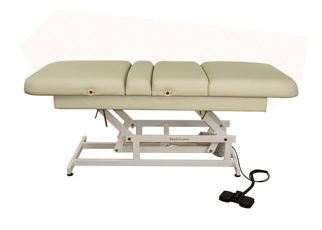TouchAmerica HILO MULTIPRO beige ADA table with metal frame and attached foot controls.