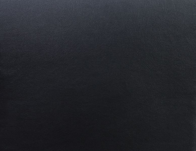 Close-up of ACME Furniture Pacari Massage Chair’s black PU textured leather surface.