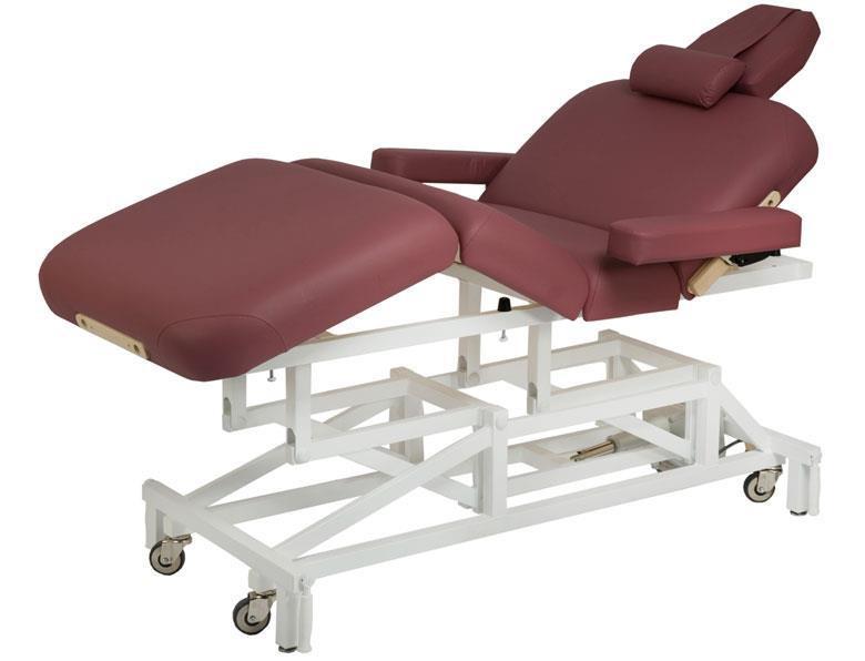 Custom Craftworks MCKENZIE DELUXE massage table with maroon cushions and wheeled white frame.