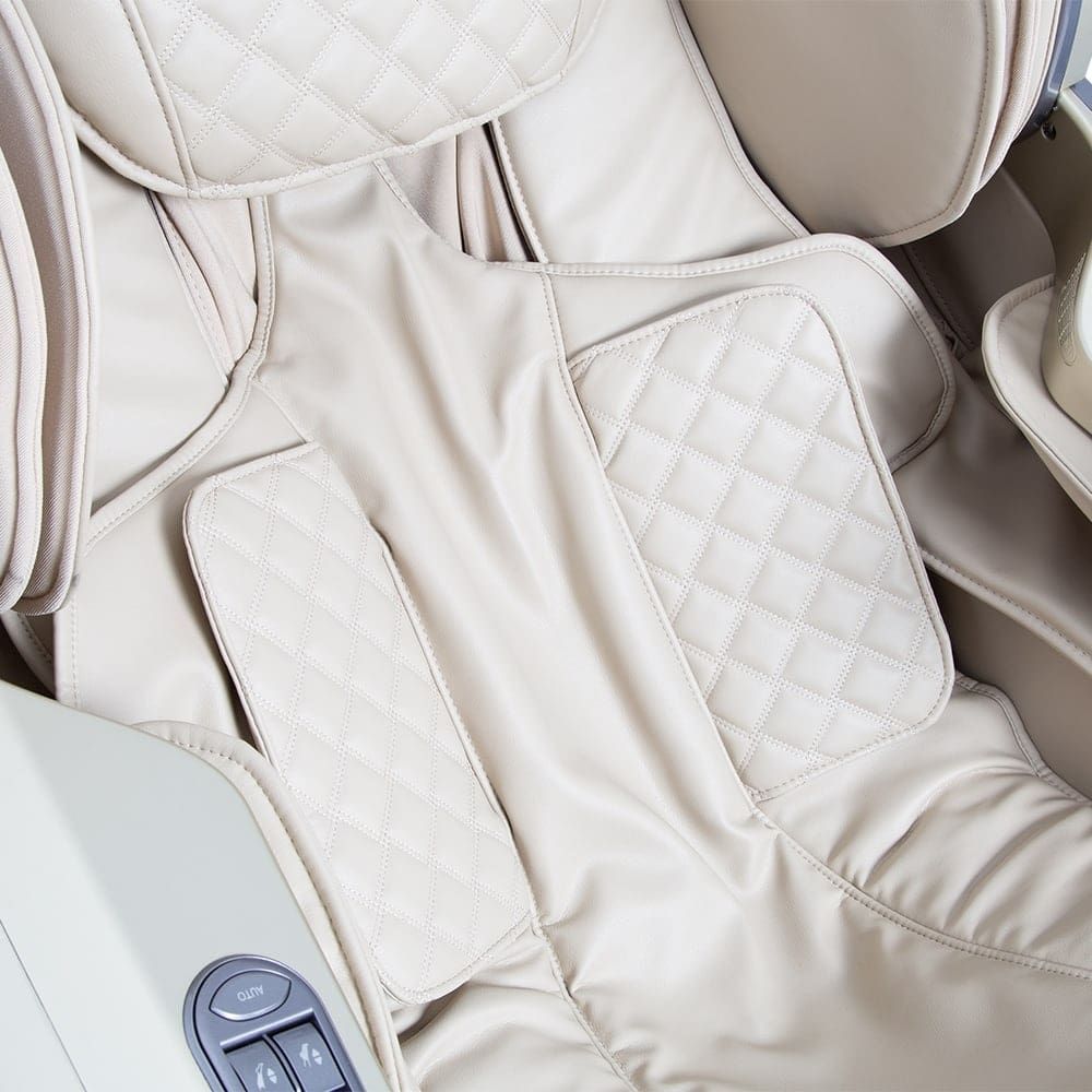 Close-up of the Osaki OS-PRO FIRST CLASS massage chair seat with quilted stitching and controls.