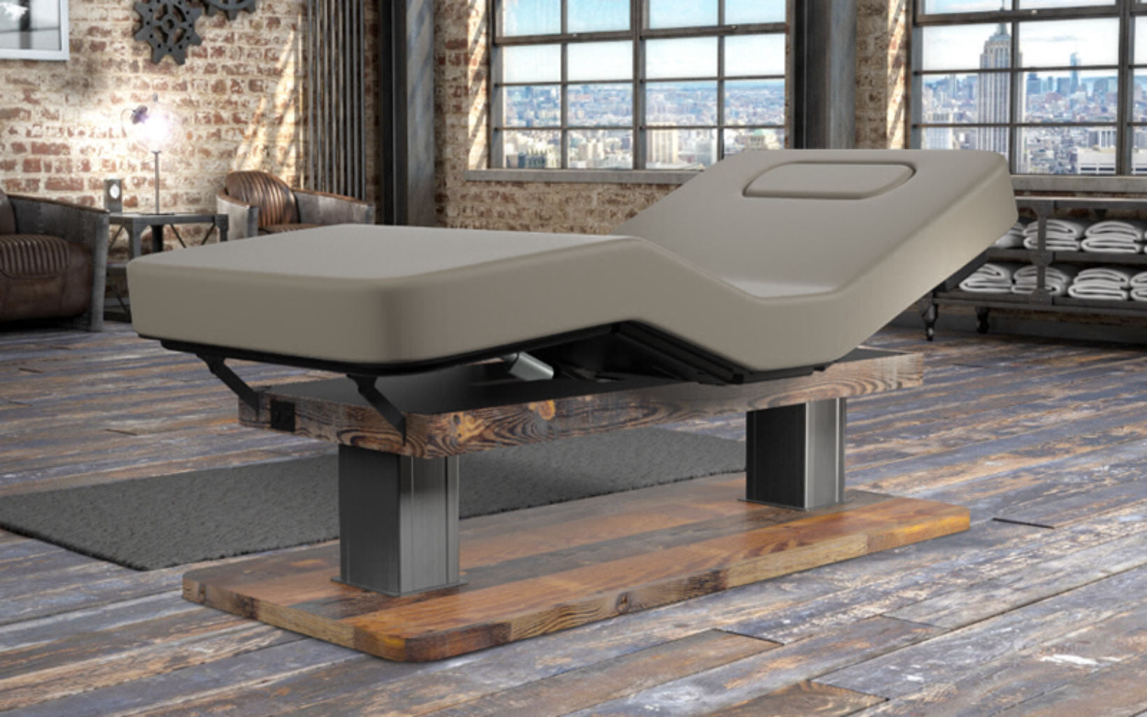 Oakworks Spa PALAS Master's Collection Table in a modern loft with wood and metal accents.
