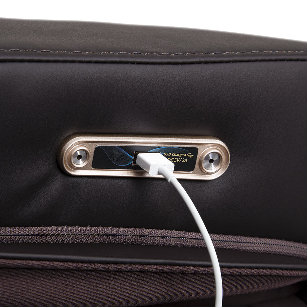 Close-up of a USB port on the Osaki Pro 3D SIGMA Massage Chair with a cable plugged in.