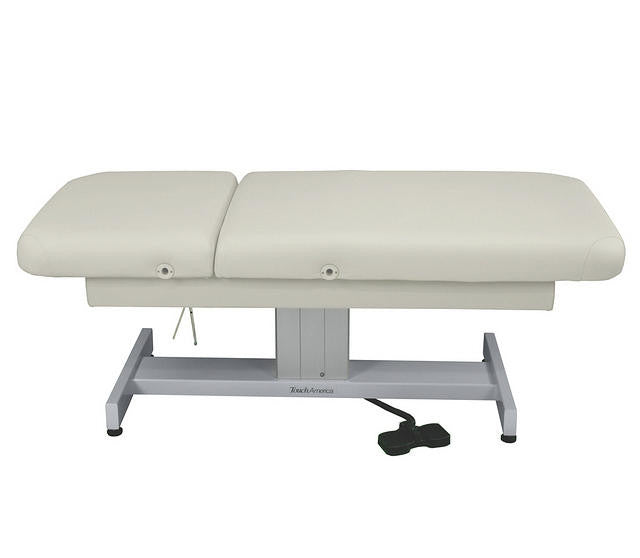 TouchAmerica VENETIAN electric lift table with adjustable height, metal base, and foot pedal.