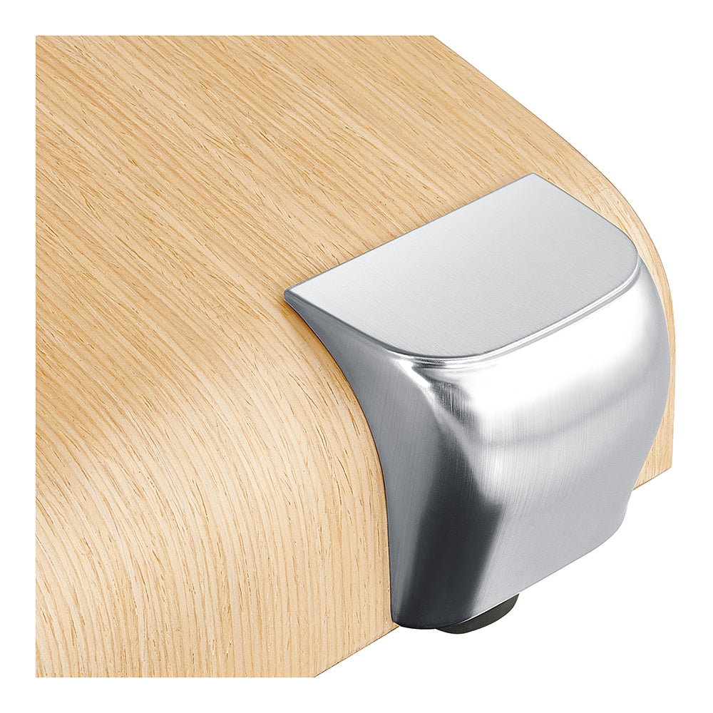 Close-up of a metal corner protector on the Luxi 4 Motors Medical Spa Treatment Table by DIR.