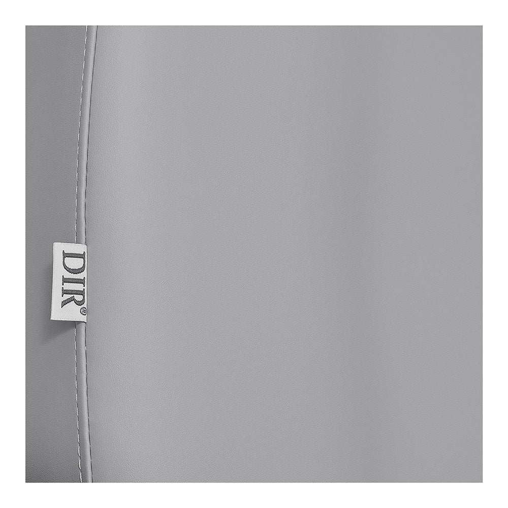 Close-up of Sydney Medical Chair's light gray leather surface with DIR fabric tag.