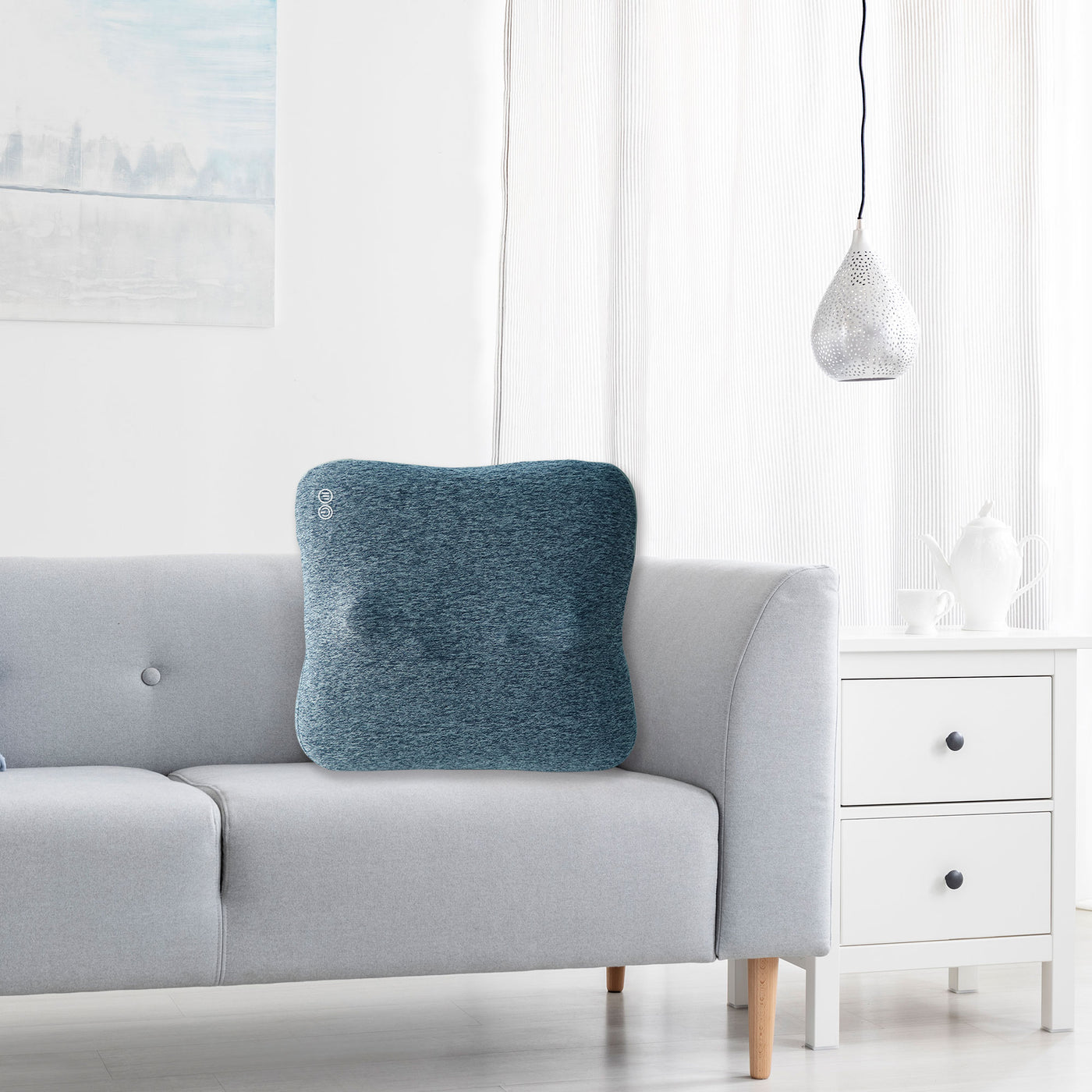 Master Massage Bravo Shiatsu 4D Kneading Deep Tissue Massage Throw Pillow Grey Blue in a bright living room with white walls and a white side table.