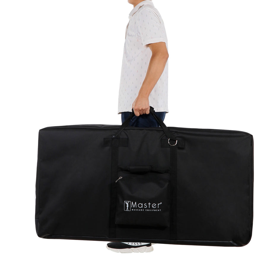 Person carrying a Master Massage MARS SPORT Portable Treatment Table bag with handles and pocket.