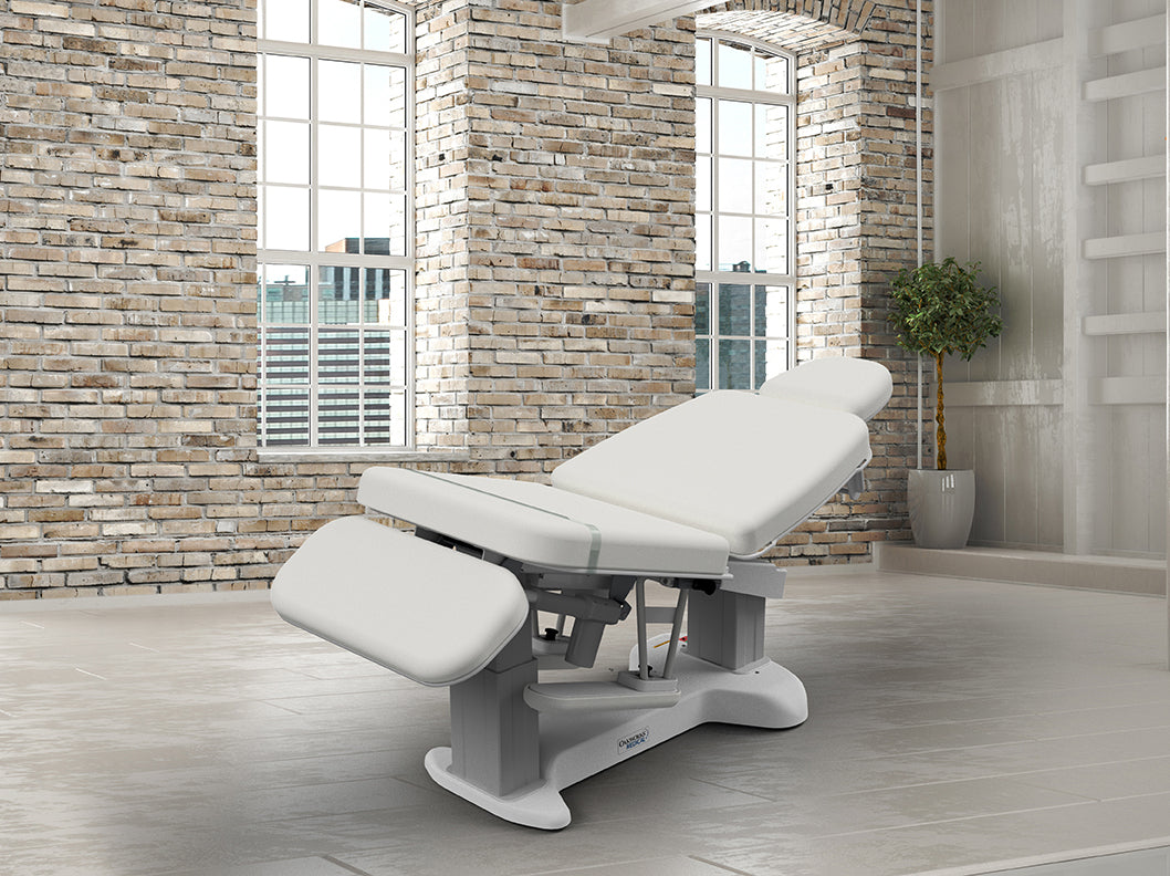Oakworks 3000 Series Procedure Chair in a modern room with brick walls and large windows.