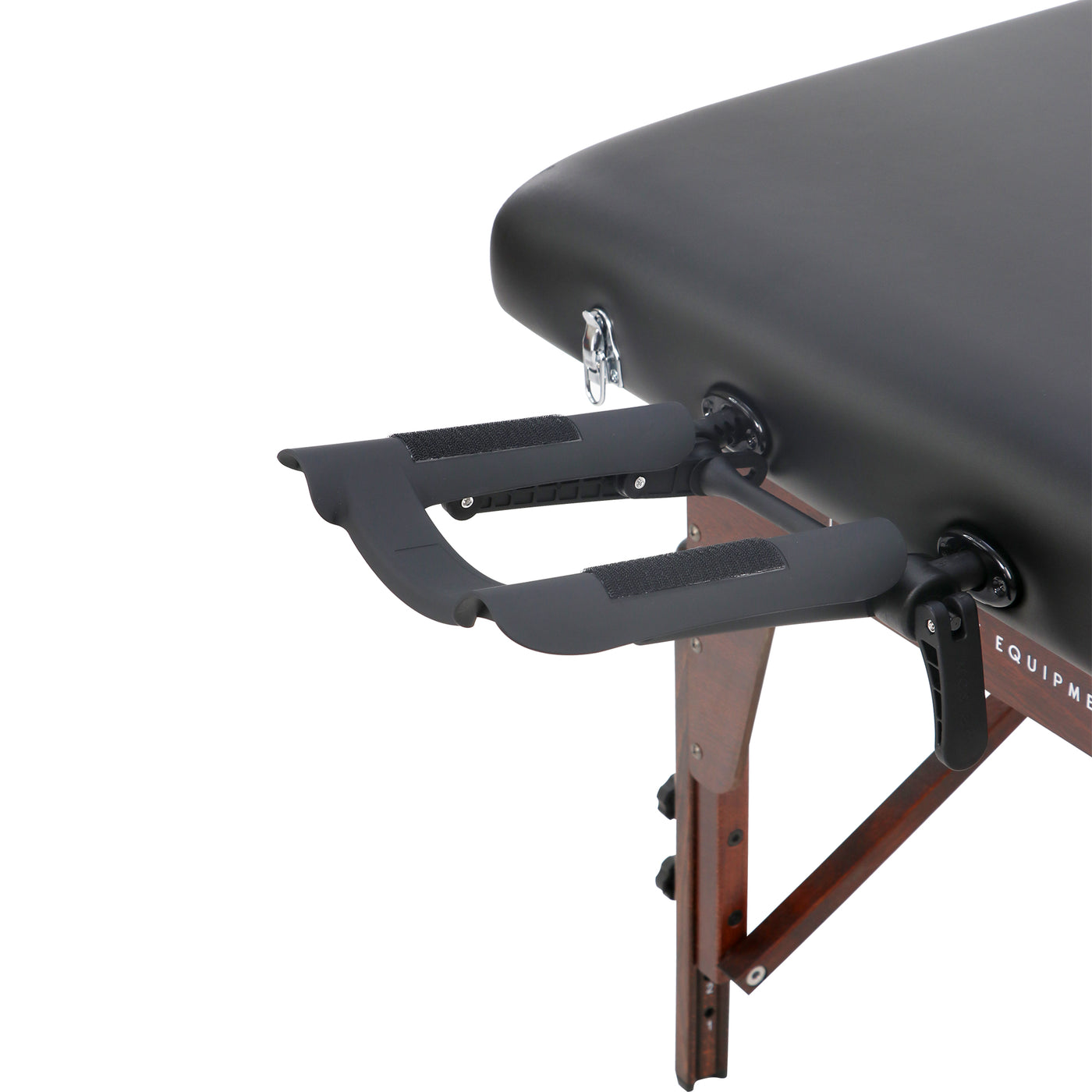 Black massage table with wooden legs on a white background
