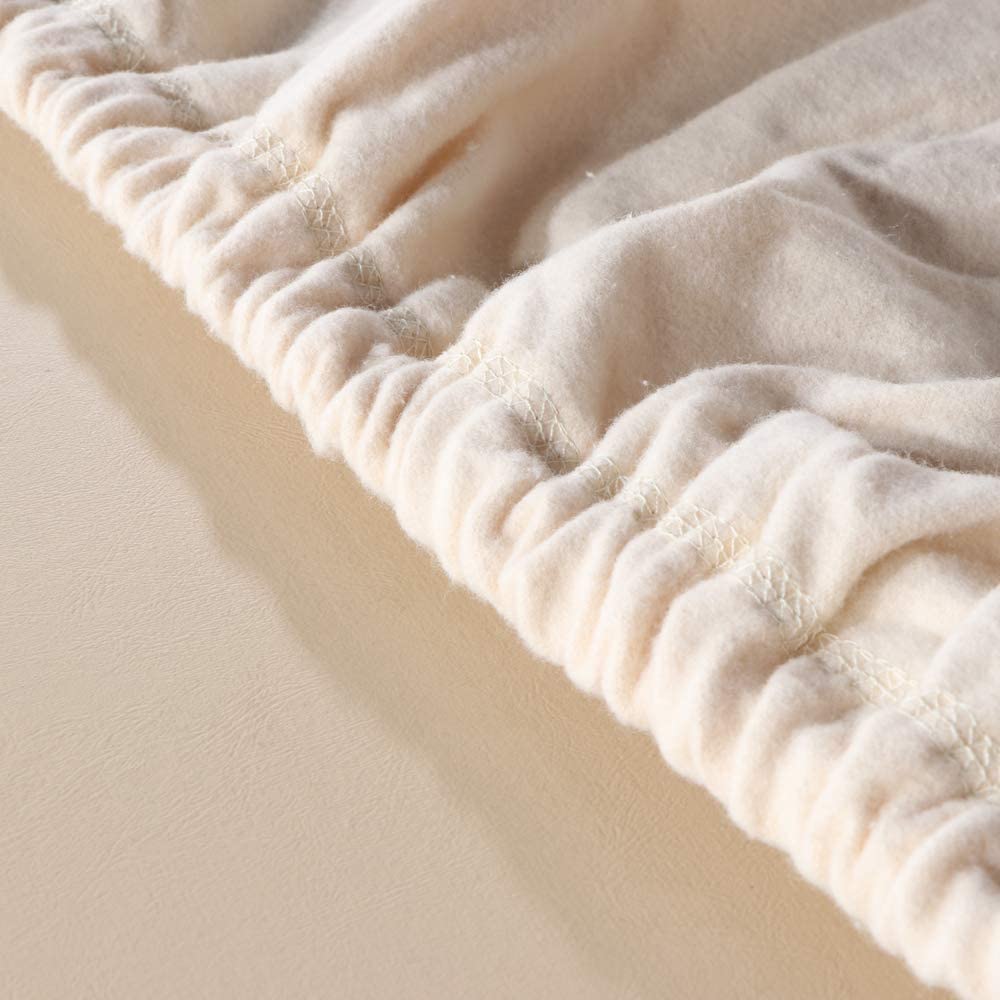 Close-up of a textured beige fabric on a light background