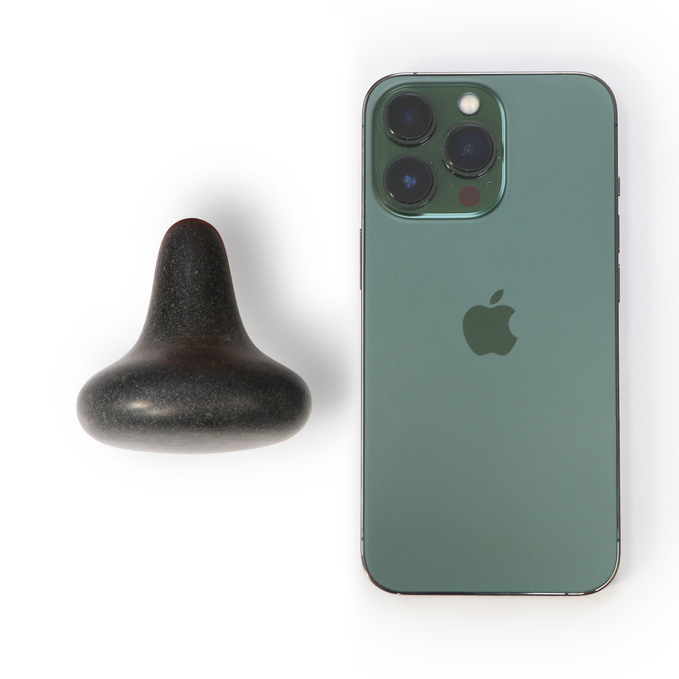 Green smartphone with Apple logo next to a MT Mushroom Shape Balsalt Hot Massage Stone Trigger Presser Point on a white background