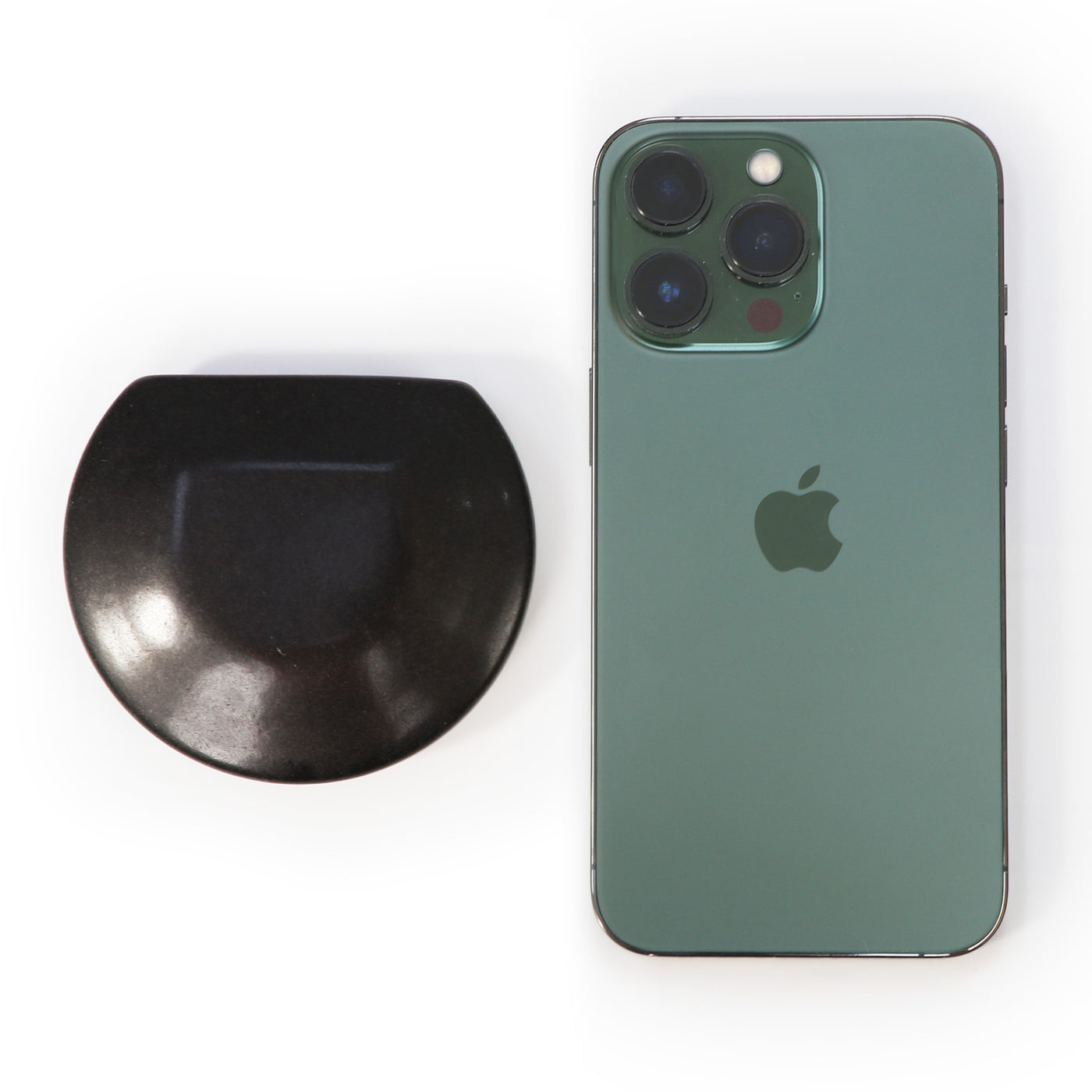 Green smartphone with Apple logo next to a MT Three Quarter 3/4 Round Balsalt Stone Rock 2 piece on a white background