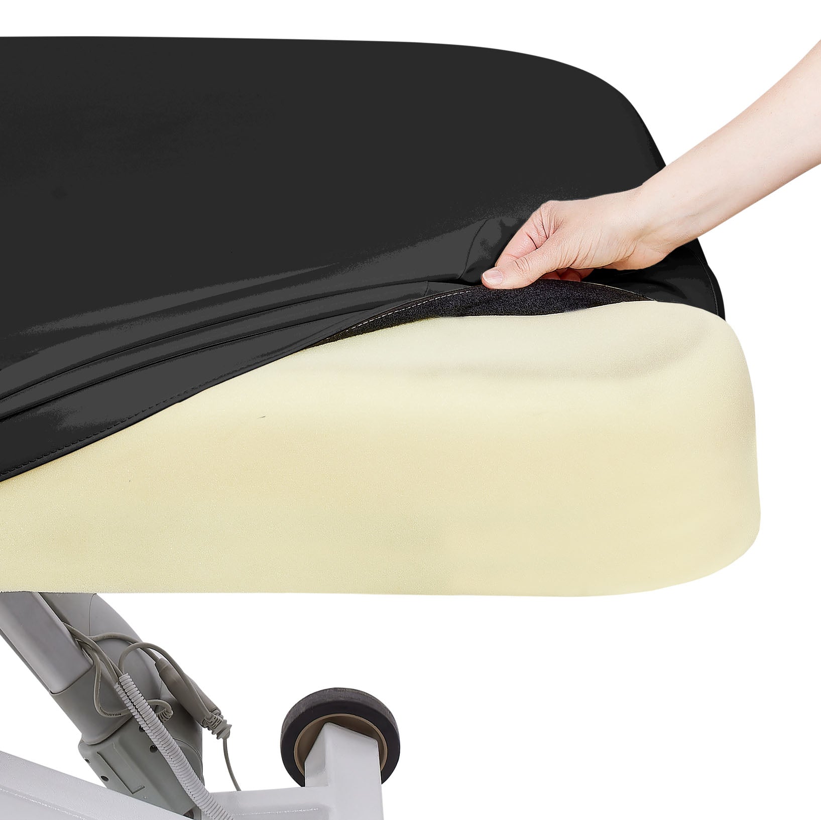 A hand pulls a black cover over a yellow EarthLite Ellora LX Tilt treatment table with wheels.