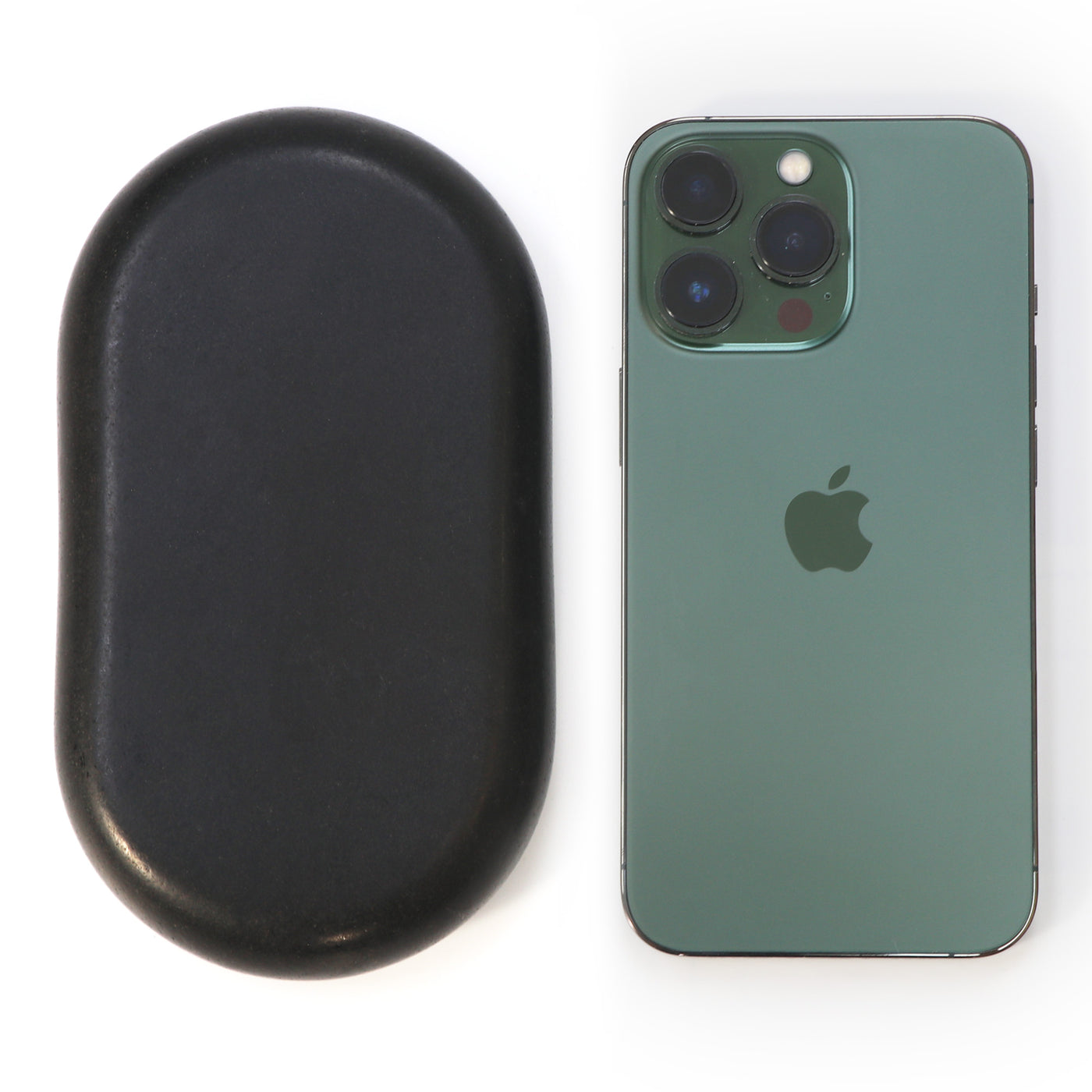 Master Massage XX Extra Large Flat Ovular Basalt Hot Massage Stone 4 piece Pack next to a green iPhone on a white background