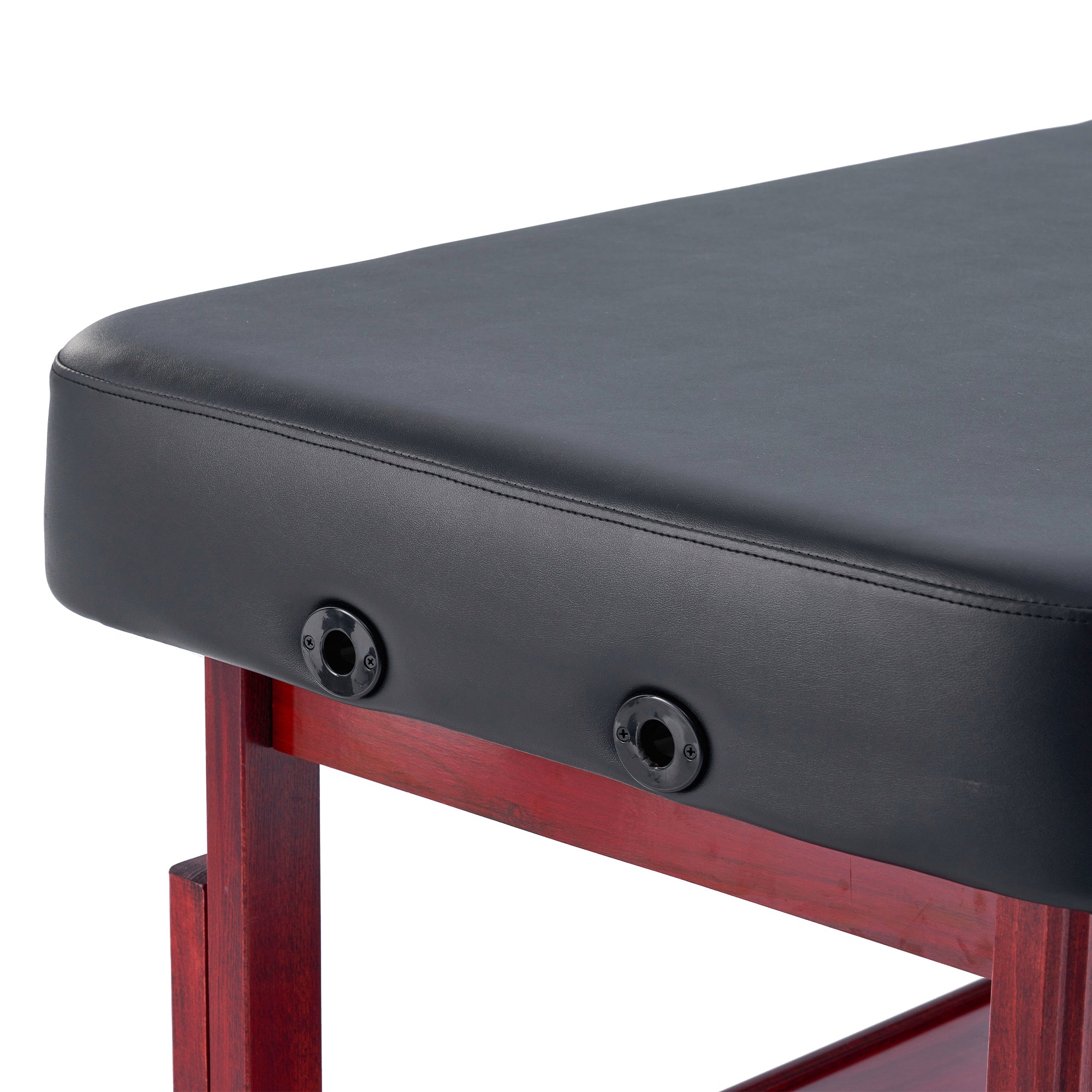 Close-up of Master Massage AirMaster Stretching Table with black cushion, wood legs, and adjustment knobs.