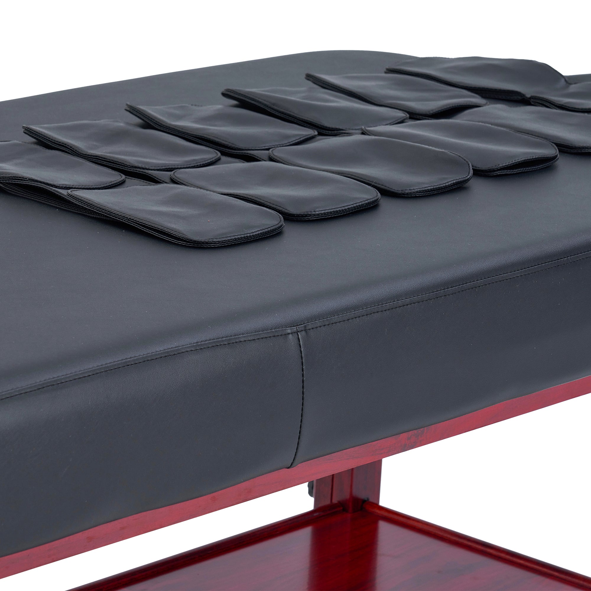 Master Massage AirMaster Stationary Table with black pouches for lumbar traction therapy.