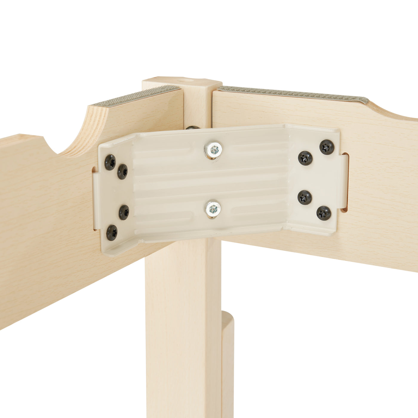 Close-up of a wooden table with metal brackets and screws on a white background