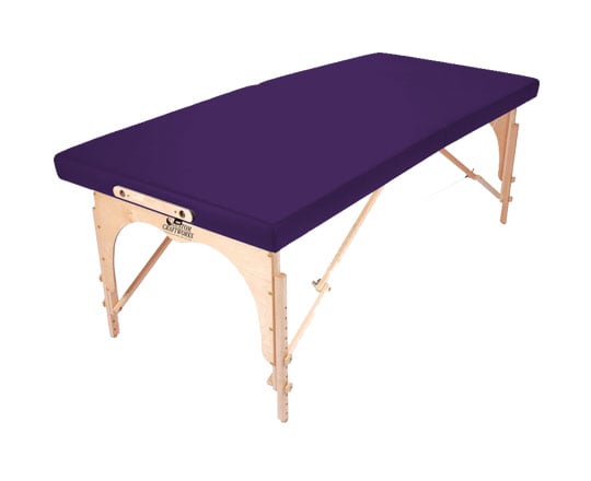 The Custom Craftworks ALEXANDER TECHNIQUE Portable Table has a purple cushion and birch legs.